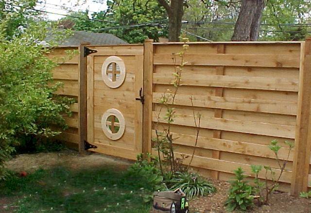 Custom cedar gate with decorative hardware and trim