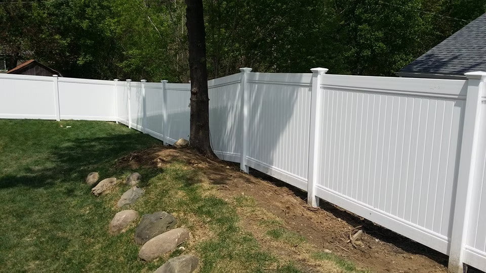White vinyl fence with wide panels