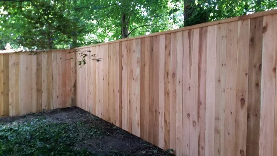 Cedar solid fence with 2x4 top